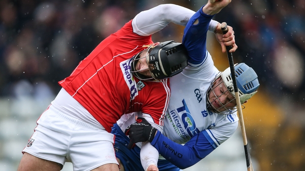 Cork's Eoin Cadogan and Waterford's Tom Devine battle for possession at Páirc Uí Rinn