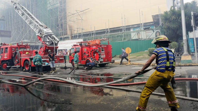 Clouds of smoke covered several floors of the building and swathed ladders of firefighters, some of whom had difficulty breathing