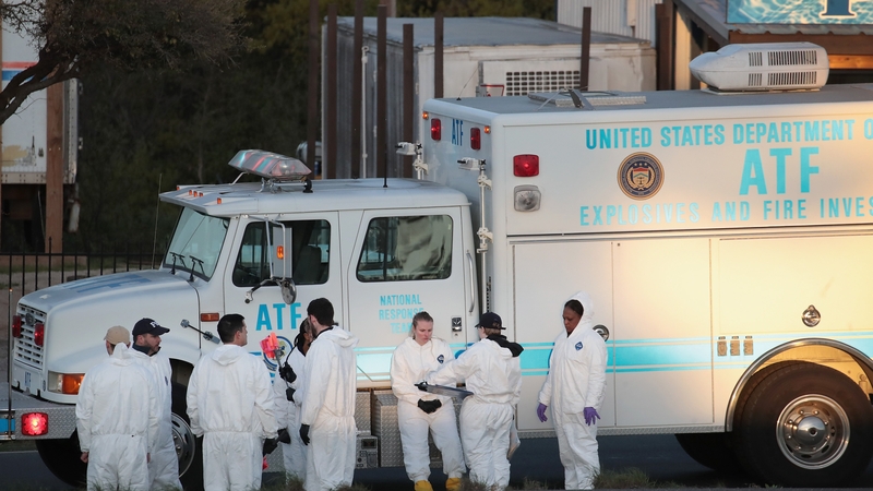 Investigators at the location where the bombing suspect blew himself up after being confronted by police