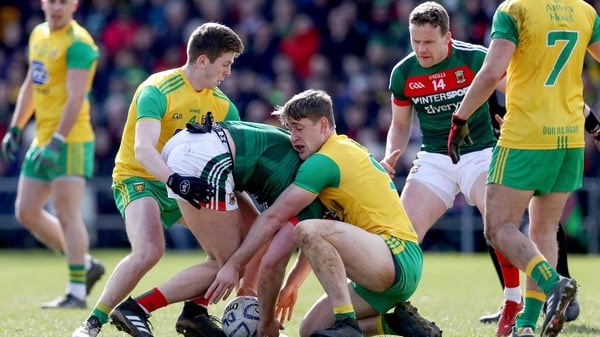 Mayo's Aidan O'Shea tangles with Hugh McFadden and Eoghan Ban Gallagher of Donegal
