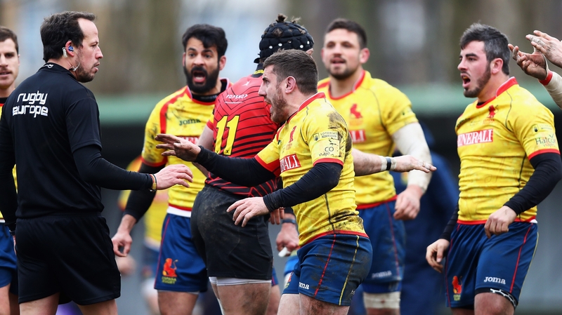 Spain players remonstrate with Romanian referee Vlad Iordachescu (far left)