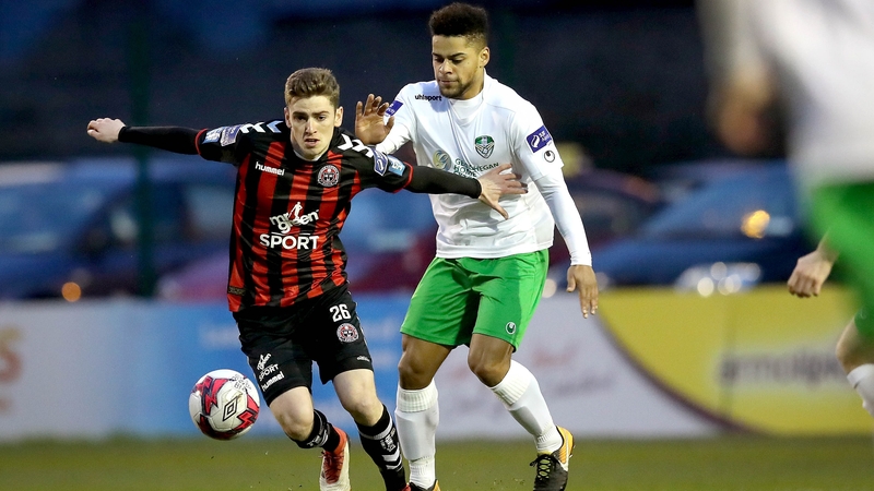 Dylan Watts and Kaleem Simon battle for possession in the EA Sports Cup clash