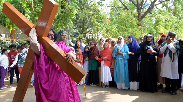 An Indian actor re-enacts the crucifixion of Jesus during a passion play in Bangalore