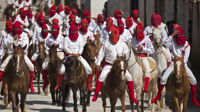 People take part in the traditional ceremony of The Spies during the Holy Thursday celebrations in Tzintzuntzan, Mexico