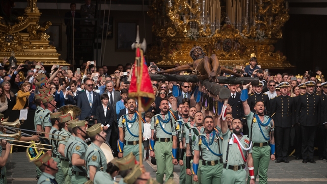 Spanish legionnaires carrying a figure of 'Cristo de la Buena Muerte' (Christ of the good death) during a procession in Malaga