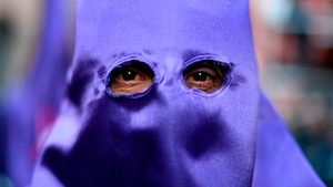 A man takes part in the 'Jesus Nazareno, el pobre y Maria Santisima del Dulce Nombre' (Jesus the Nazarene, the poor and Holy Mary of the Sweet Name) procession in Madrid
