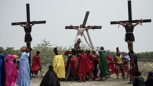A Christian devotee is nailed to a cross during a re-enactment of the crucifixion north of Manila in the Philippines