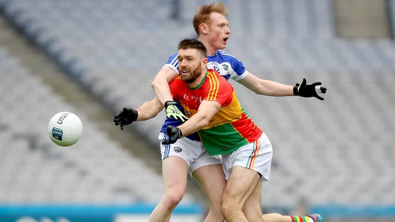 Carlow's Shane Redmond with Brian Glynn of Laois