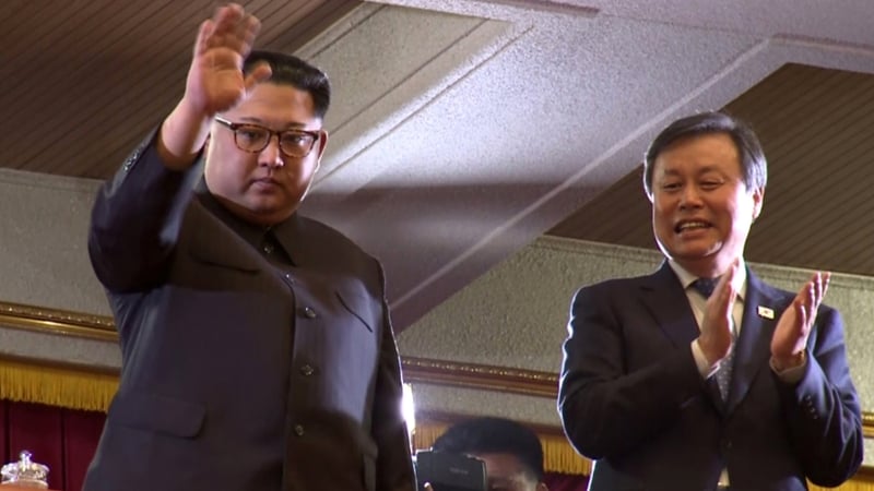 Kim Jong-un (L) and South Korea's Culture Minister Do Jong-hwan during a performance of the South Korea's art troupe in Pyongyang yesterday