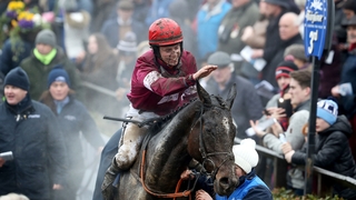 Jockey JJ Slevin celebrates winning the Irish Grand National aboard General Principle