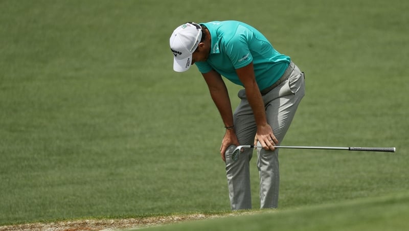 Danny Willett reacts after one of his shots at the Masters in Augusta.