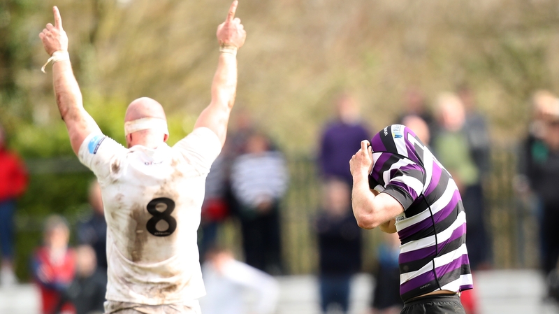 Terenure College's Sam Coughlan Murray dejected after a missed drop goal to level the score against Cork Con