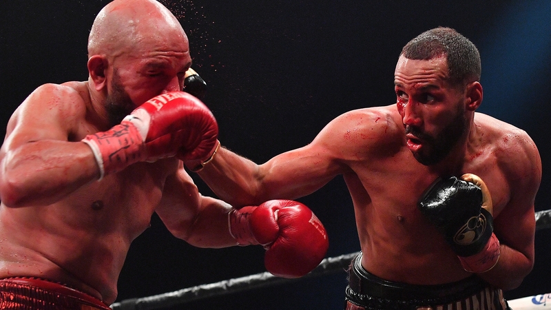 James DeGale (r) lands a right on Caleb Truax