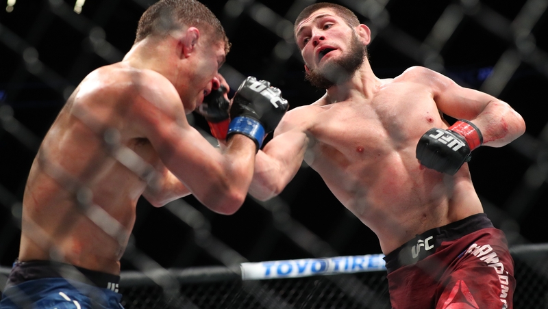 Khabib Nurmagomedov (r) lands a right uppercut on Al Iaquinta