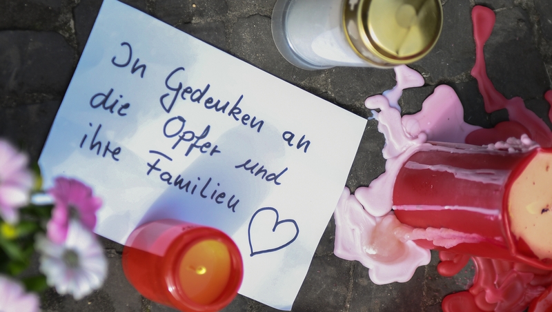 Candles, flowers and messages for the victims and their families were left at the scene of the attack in Muenster