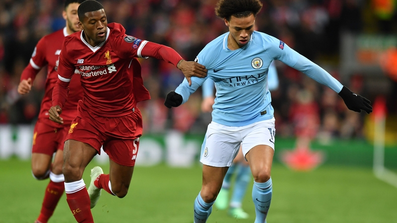 Georginio Wijnaldum vies with Leroy Sane during the first leg