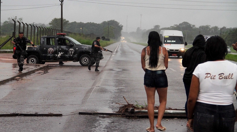 Policemen at Santa Izabel Penitentiary Complex after breakout attempt