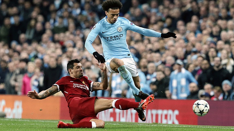 Manchester City's Leroy Sane is tackled by Liverpool's Dejan Lovren