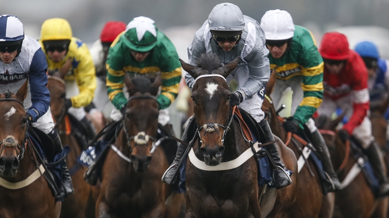 Santini (centre, grey) on the way to winning the Doom Bar Sefton Novices' Hurdle