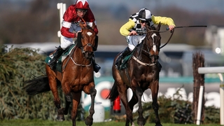 Davy Russell riding Tiger Roll (L) clear the last to win The National