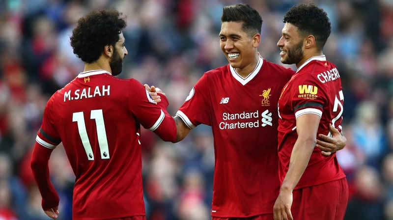 Mohamed Salah congratulates Roberto Firmino after a goal.