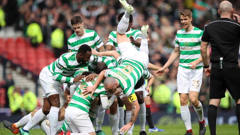 Celtic players celebrating one of their two goals against city rivals Rangers.