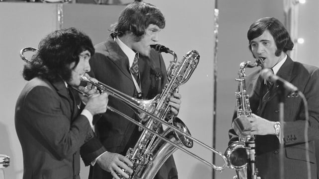 Big Tom (centre) plays saxophone with two members of his band The Mainliners, on stage in Dublin's Cabra Grand Cinema in October 1971.