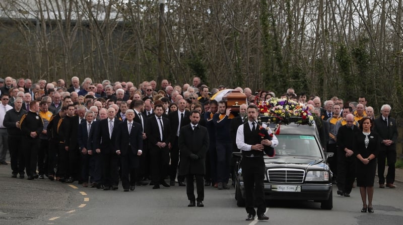 The cortege is seen making its way towards St Patrick's Church