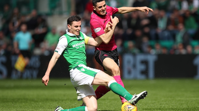 Paul Hanlon of Hibernian vies with Tomas Rogic of Celtic