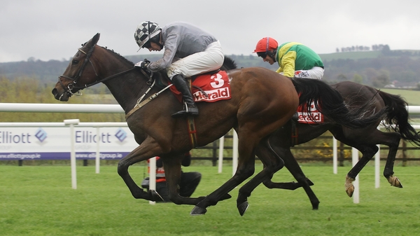 Noel Fehily on Draconian (3) wins the Herald Champion Novice Hurdle from Robbie Power on Vision des Flos