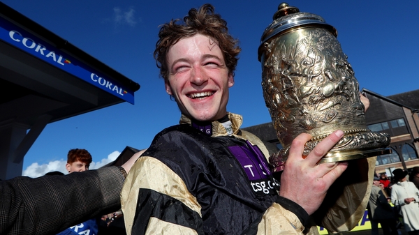 Winning jockey David Mullins celebrates with the Gold Cup