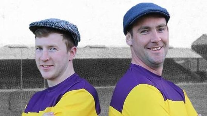 Michael Furlong and captain Daithí Waters (R) model the commemorative jersey