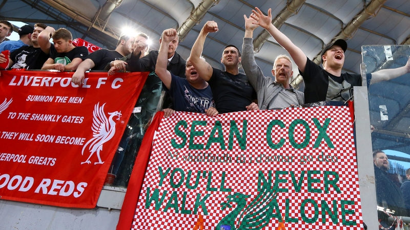 Liverpool fans hang a banner in support of Meathman Sean Cox in Rome
