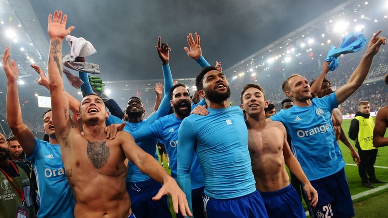 The Marseille players celebrate at the end after ensuring their place in the Europa League final