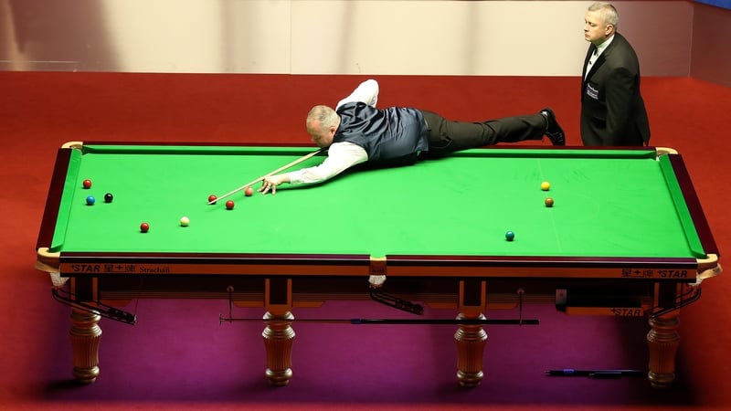 John Higgins in action against Kyren Wilson