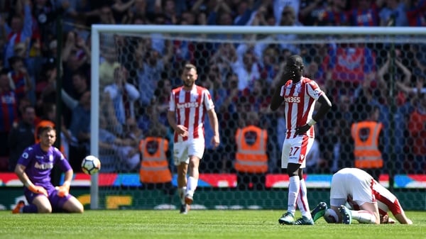 Stoke players despondent as their relegation from the Premier League is confirmed