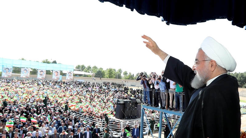 Iranian President Hassan Rouhani greets the crowd in the city of Sabzevarr, northwestern Iran, today
