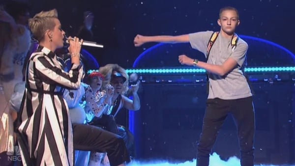 Katy Perry with the scene-stealing 'Backpack Kid' who stole her Saturday Night Live performance