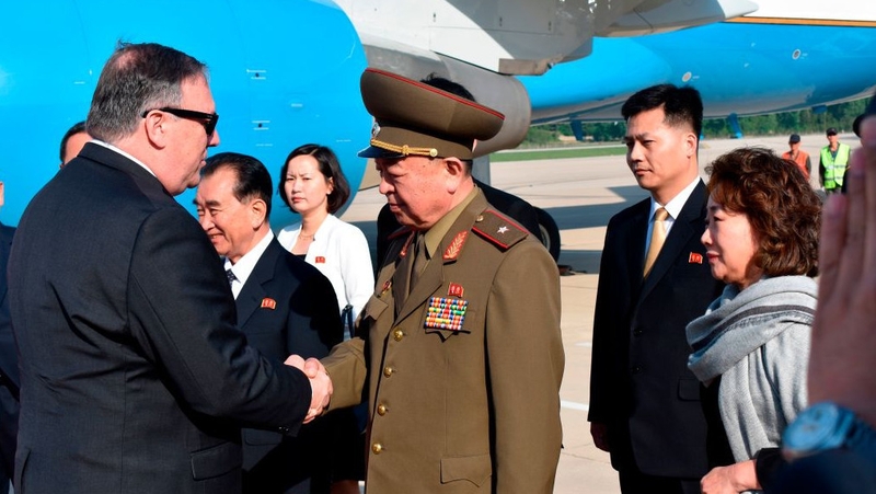 Mike Pompeo greets an unidentified North Korean general on arrival at North Korea airport today