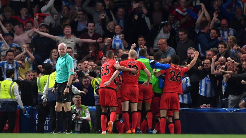 The Terriers celebrate the goal that should keep them in the top flight