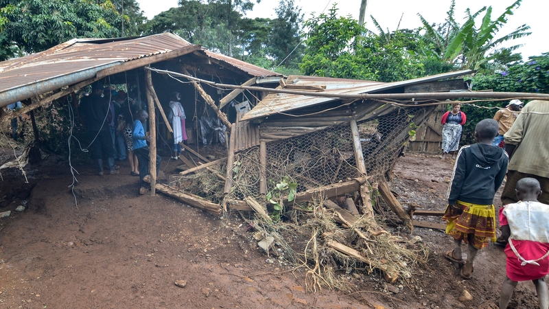The floodwaters carved out a dark brown chasm in the hillside and swept away everything in their path - power lines, homes and buildings