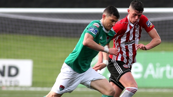Derry's Eoin Toal and Cork's Graham Cummins