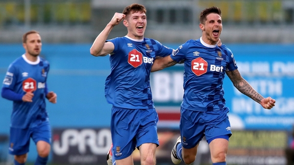 Rory Feely celebrates with Waterford goal-scorer Gavan Holohan