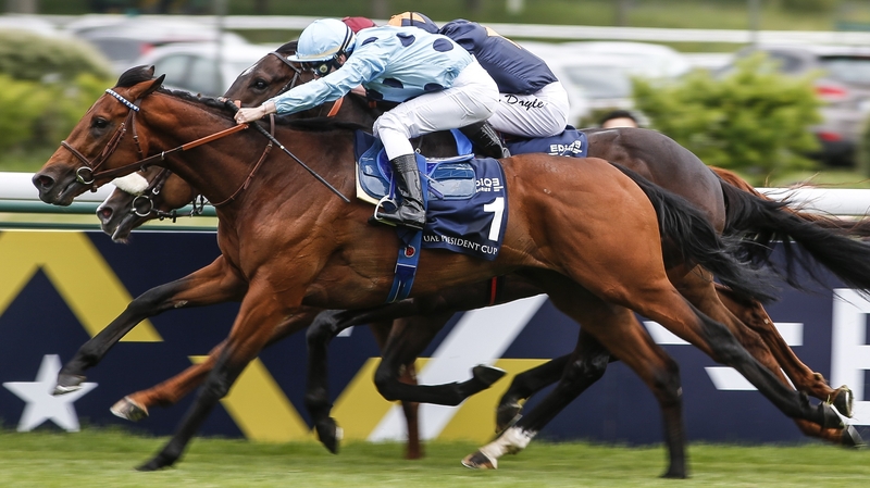 Cristian Demuro riding Olmedo (nearest, blue) wins The Emirates Poule d'Essai des Poulains at Longchamp