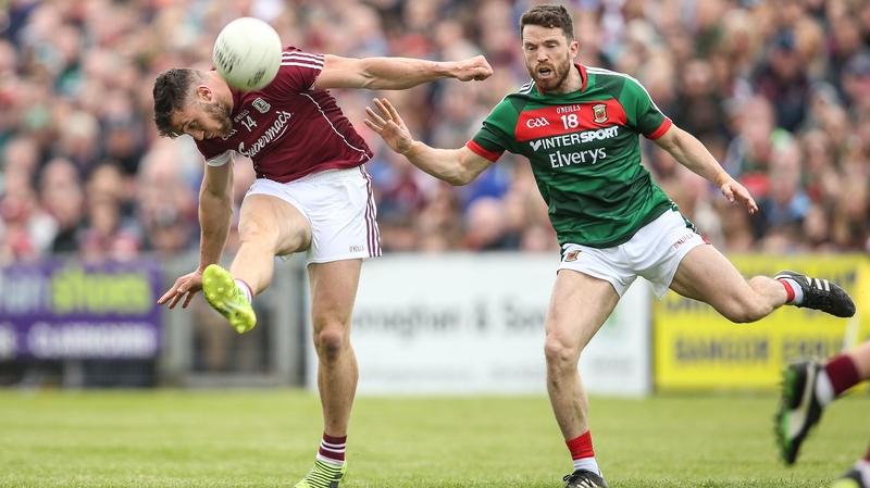 Galway's Damien Comer get his shot away despite pressure from Chris Barrett