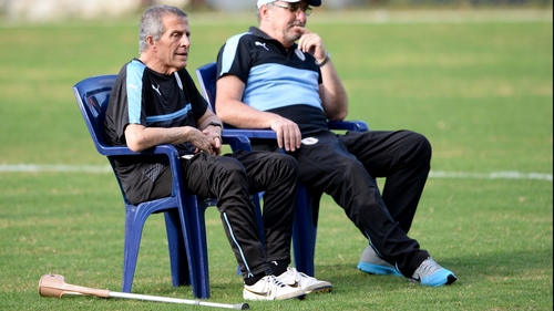 Tabarez watches training from a seat with a crutch by his side