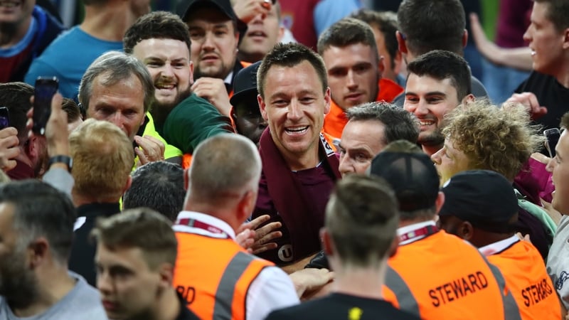 John Terry celebrates at the full time whistle during the pitch invasion following the victory over Middlesbrough in the play-off semi-final