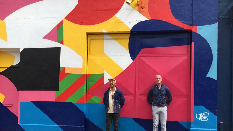 Maser and Team Limerick Clean-up ambassador Paul O'Connell standing in front of the artwork