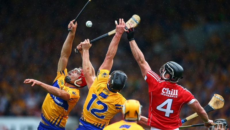 Clare's Peter Duggan and John Conlon compete with Cork defender Colm Spillane during the 2017 Munster final