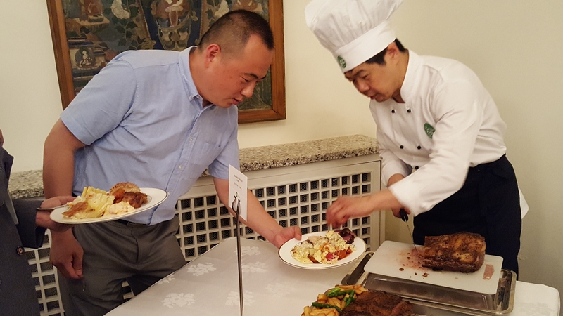 Guests enjoy some Irish beef at a reception at the Irish embassy in Beijing